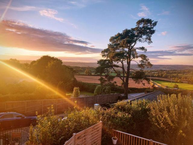 Suite room with double bath shower ensuite boasting views over the Axe Valley from your lounge dining and kitchen area Free parking and Free WiFi Lyme Regis & Charmouth are nearby