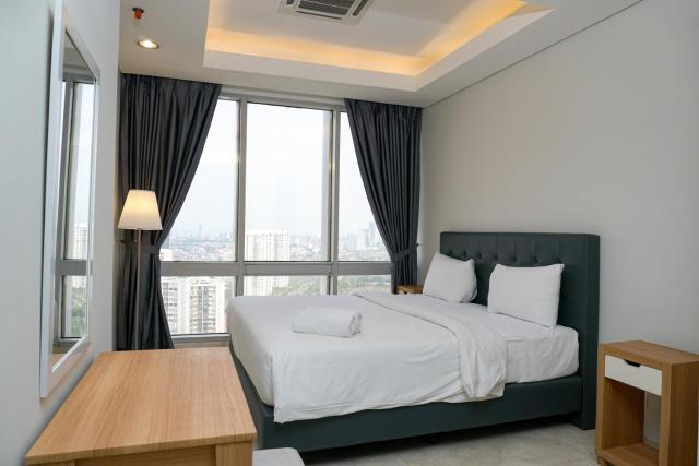 Modern and Comfortable 2BR at The Masterpiece Condominium Epicentrum Apartment By Travelio