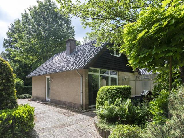 Attractive house with two bathrooms on a holiday park in the woods