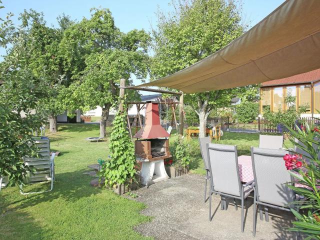 Apartment with terrace and pool in the garden