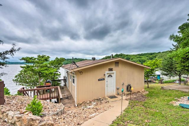 Lakefront Ozark Cottage Deck with Covered Dock!