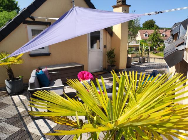 "Le Rooftop de la fontaine" dans cadre verdoyant