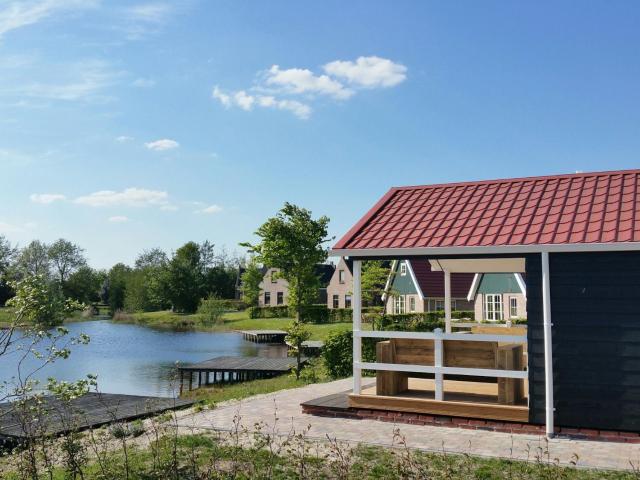 Chalets with a bathroom, near a pond