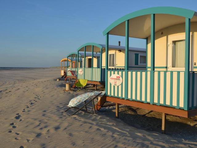 Cozy chalet with veranda on the beach