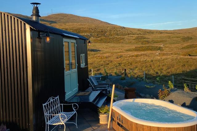 Black hut at Slieve Croob Glamping