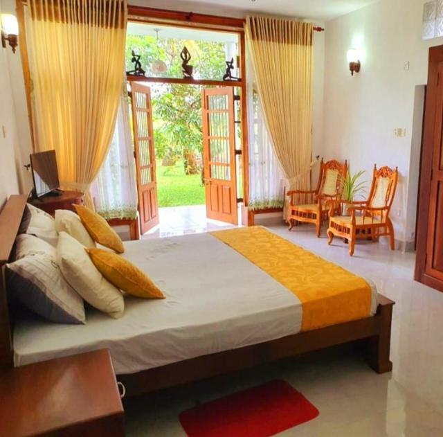 GreenHeart Villa- Family Room - AC, Garden View with, separate Varanda & Dining Area