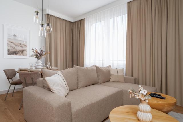 Stylish Beige Apartment with One Bedroom and Parking in Poznań by Noclegi Renters