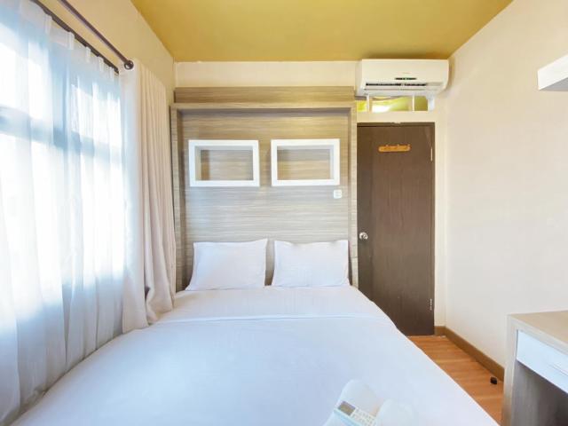 Simply Homey 2BR at Suites @Metro Apartment By Travelio