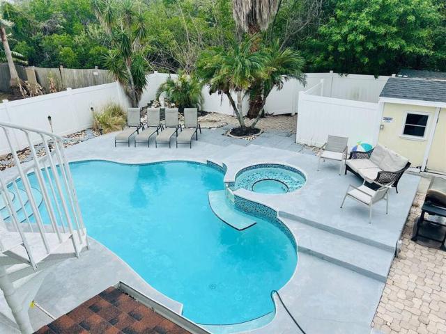 4 Bedroom home with heated pool by the beach!