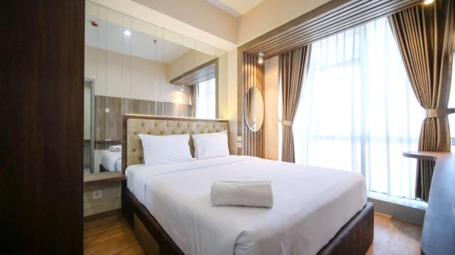 Nice and Comfortable Living 1BR at Grand Sungkono Lagoon Apartment By Travelio