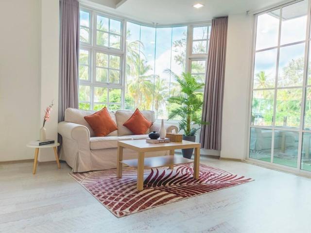 Cozy 1BR apartment by beach - partial ocean view