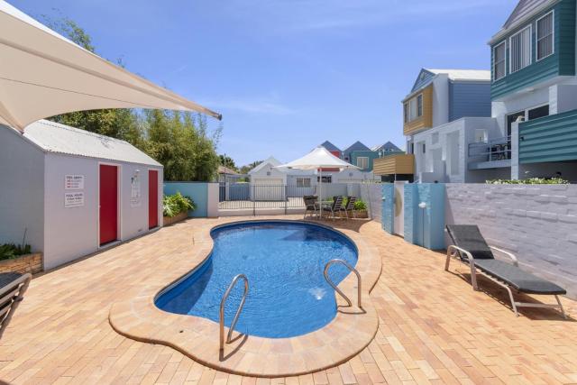 2-Bed Coastal Haven: River Views Swimming Pool