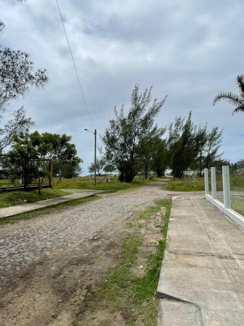 Casa pé na areia em capão da canoa