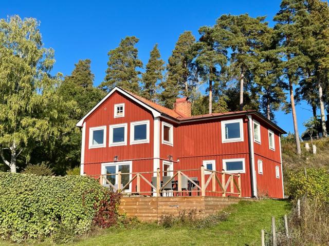 Flemma Gård The lake view with sauna