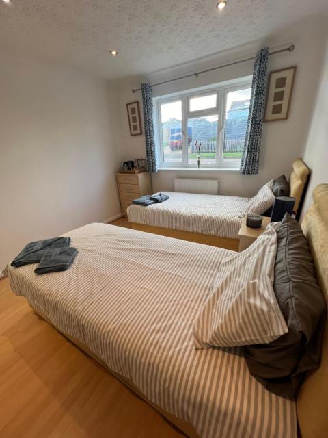 Twin room at The Bungalow with shared shower room