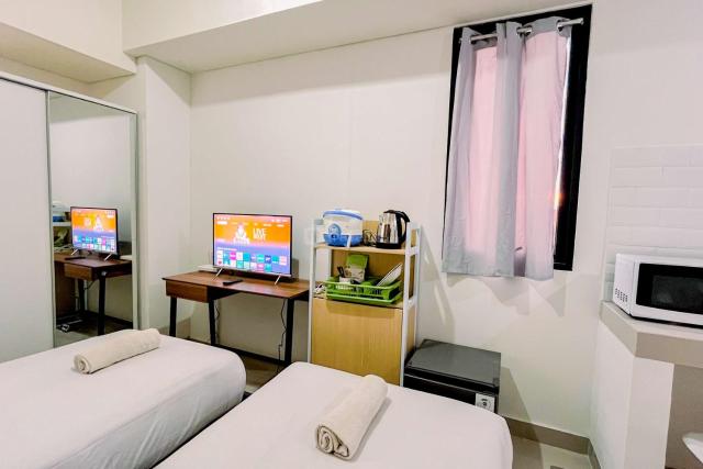 Modern Studio (No Kitchen) at Bandaraya - Tallasa City Makassar Apartment By Travelio