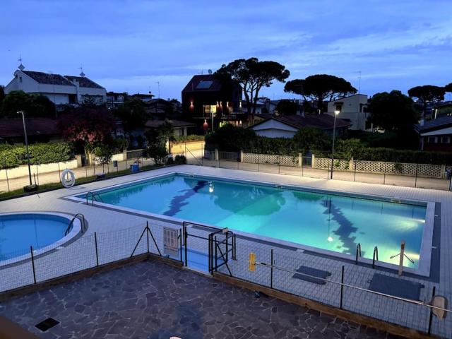 Appartamento con piscina Lignano