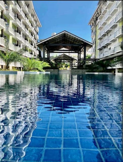 212B Amani Grand Resort Residences near to Airport with pool, gym, wifi, netflix