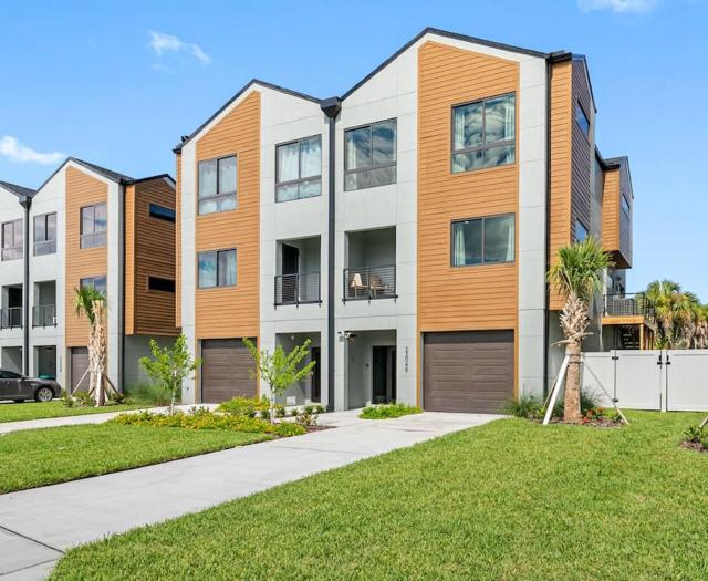 Blocks from the beach with a golf cart and pool!