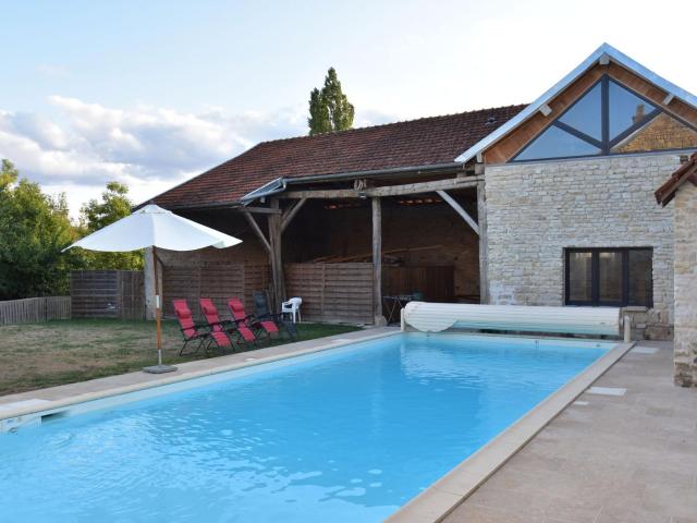 Holiday home with private heated pool