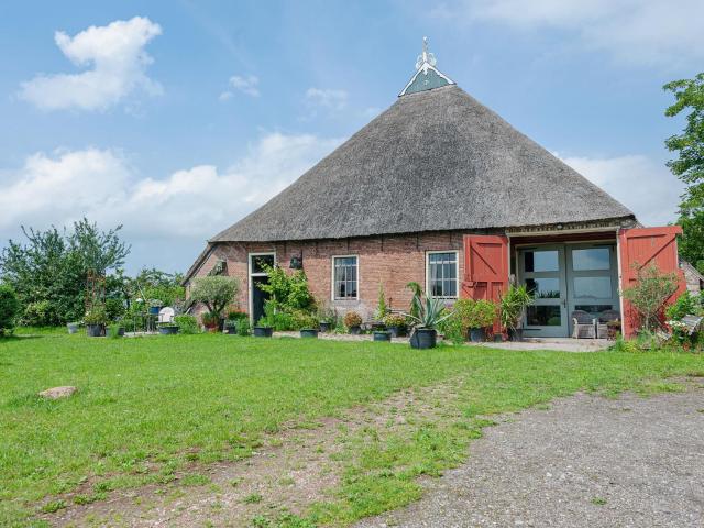 Characteristic head neckhull farm with rowing boat