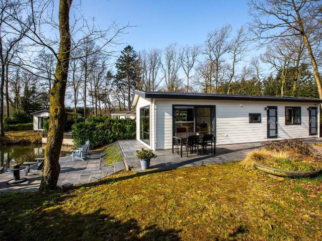 Modern chalet with two terraces and near a pond